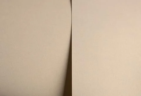 Paper background with matte texture. Smooth golden beige surface in soft past Foto stock