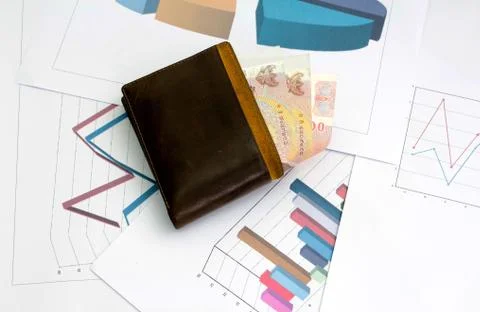 Paper bag place on sheet graph and chart for report work Stock Photos