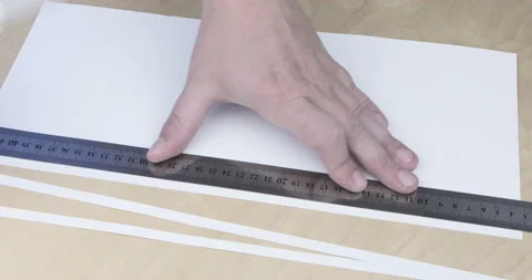 Paper being cut with razor blade and ruler close up Stock Footage 123018587