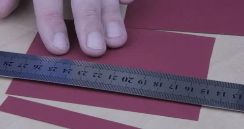 Paper being cut with razor blade and ruler close up Stock Footage 123019079