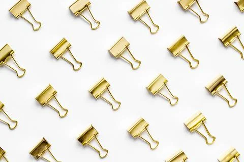 Paper binder clips pattern, copy space. Office supplies background Stock Photos