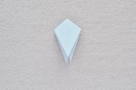 Paper bird step by step instructions. White paper on a pink background. Step  Stock Photos
