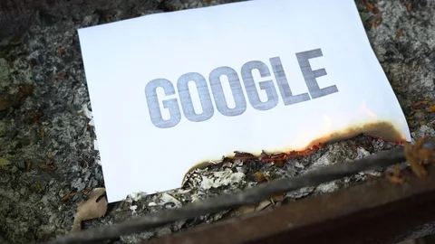 The paper with black word Google burns, smoke and turns into ashes. War concept. Stock Footage 108776762