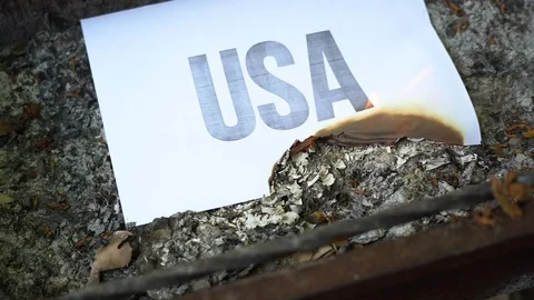 The paper with black word USA burn, smoke and turns into ashes. War concept. Video stock 108776653