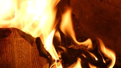 Paper with blurred text burning in fire Stock Footage 97792896