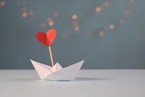 Paper boat with a flag Stock Photos