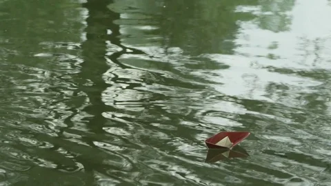 A paper boat floating Stock Footage 72226479