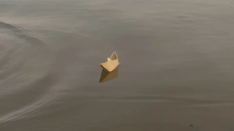Paper boat floating on the river Stock Footage 79235560