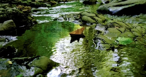 Paper boat floating on the river Stock Footage 114026902