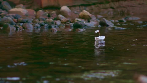 A paper boat is floating on the waves in the water. Travel, Tourism, Vacation 스톡 동영상 219327232