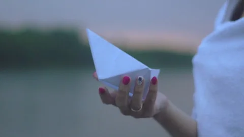 Paper boat in hand Stock Footage 93780667