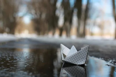 Paper boat in a pool Stock Photos