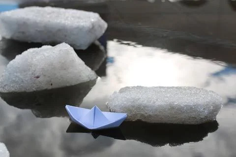 Paper boat in a pool various objects of the spring season in the best of t... Foto stock