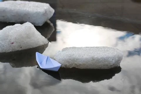 Paper boat in a pool various objects of the spring season in the best of t... Foto stock