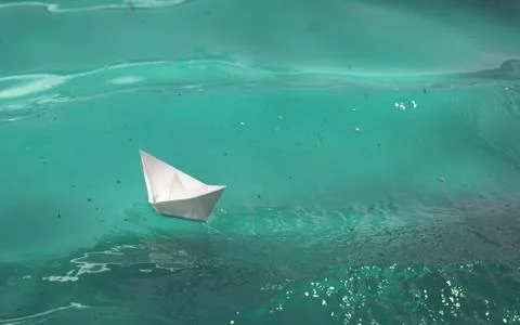 Paper Boat On The Waves Stock Photos