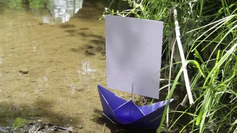 Paper boom moved by the wind that clings above the water Stock Footage 84473705