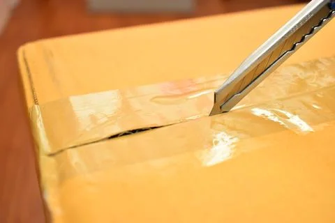 Paper box with sharp knife, packaging industry 写真素材