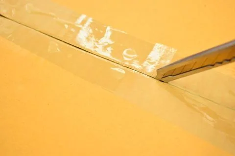 Paper box with sharp knife, packaging industry Foto stock