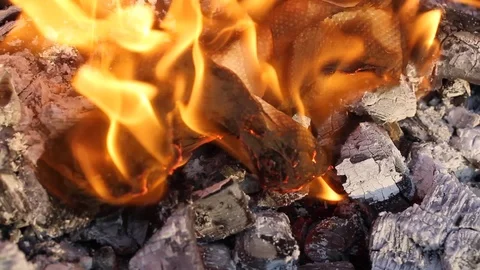 Paper is burning. Fire. Natural fire ashes with dark coals texture. Stock Footage 107109730