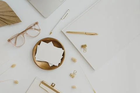 Paper card sheet with blank empty mockup copy space on gold plate. Aesthetic  Stock Photos
