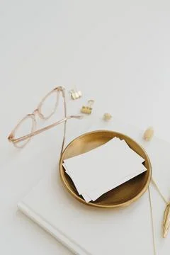 Paper card sheet with blank empty mockup copy space on gold plate. Aesthetic  Stock Photos