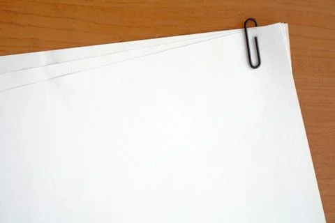 Paper clip attached to multiple sheets of paper Stock Photos