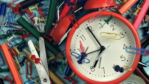 Paper clips fall on the alarm clock. Filmed on a high-speed camera at 1000 fps. Stock Footage 322833646