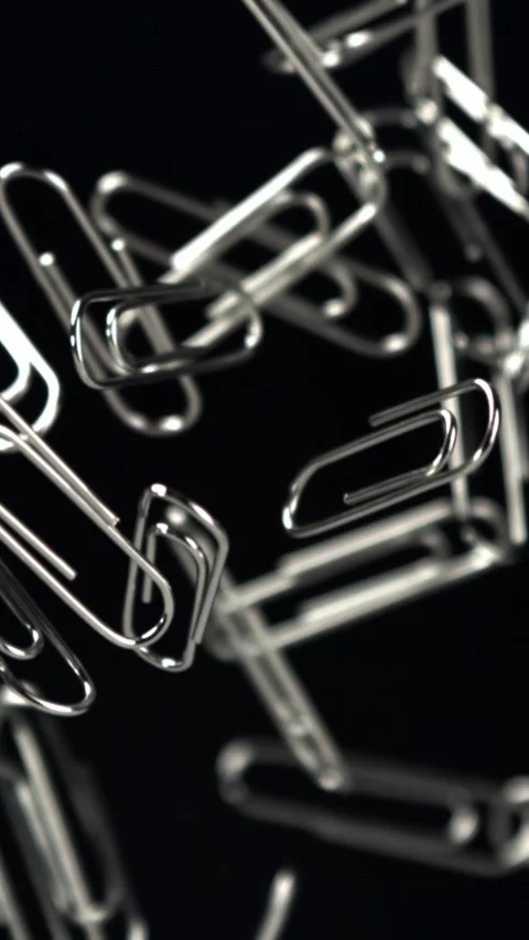 Paper clips fly and fall. Filmed on a high-speed camera at 1000 fps Stock Footage 335379163