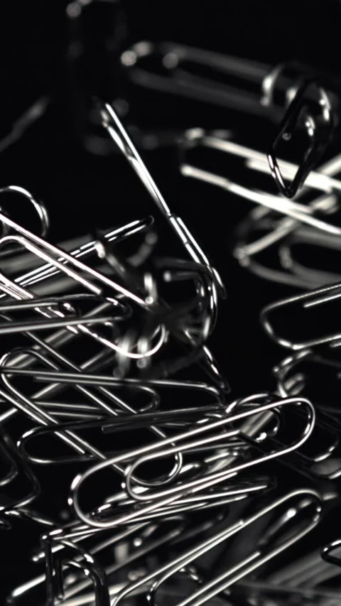 Paper clips fly and fall. Filmed on a high-speed camera at 1000 fps Stock Footage 335381041