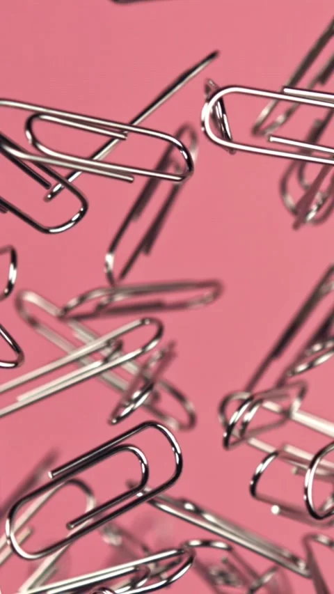 Paper clips fly and fall. Filmed on a high-speed camera at 1000 fps Stock Footage 335381626
