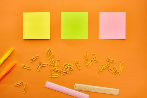 Paper clips, notepad and ruler closeup, stationery Stock Photos