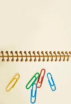 Paper clips office in an empty notebook Stock Photos