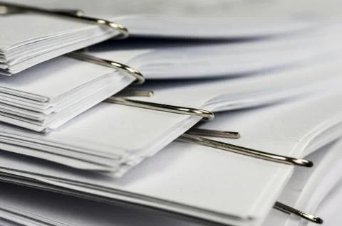 Paper clips on paperwork Stock Photos