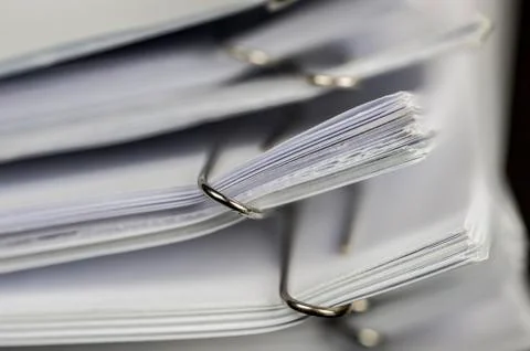 Paper clips on paperwork Stock Photos