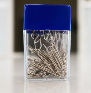 Paper clips on plastic box Stock Photos