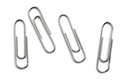 Paper clips on white background Stock Photos
