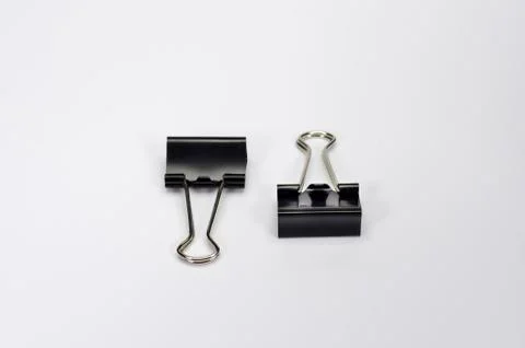 Paper clips on white background. Stock Photos