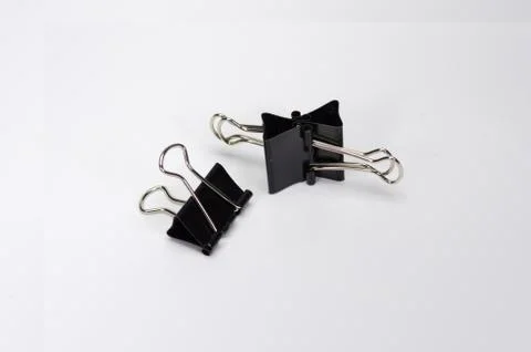 Paper clips on white background. Stock Photos