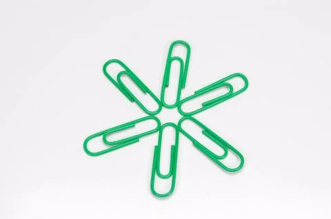 Paper clips on white background. Stock Photos