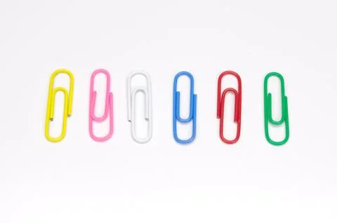 Paper clips on white background. Stock Photos