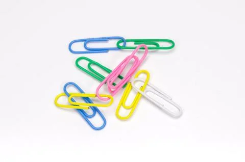Paper clips on white background. Stock Photos