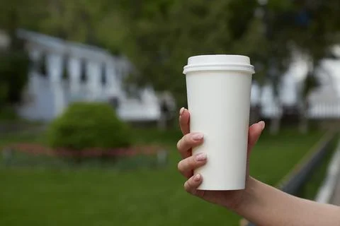 Paper coffee cup on the table, mockup, custom design, close-up Stock Photos