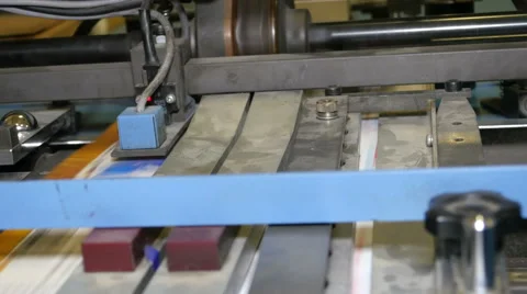 Paper on conveyor of printing press Stock Footage 65500508