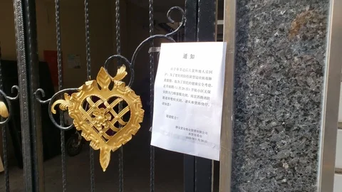 Paper with Corona Virus Warning Stuck to the Building Wall In China Stock Footage 124576089