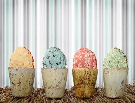 Paper covered easter eggs in decorative ceramic containers Stock Photos