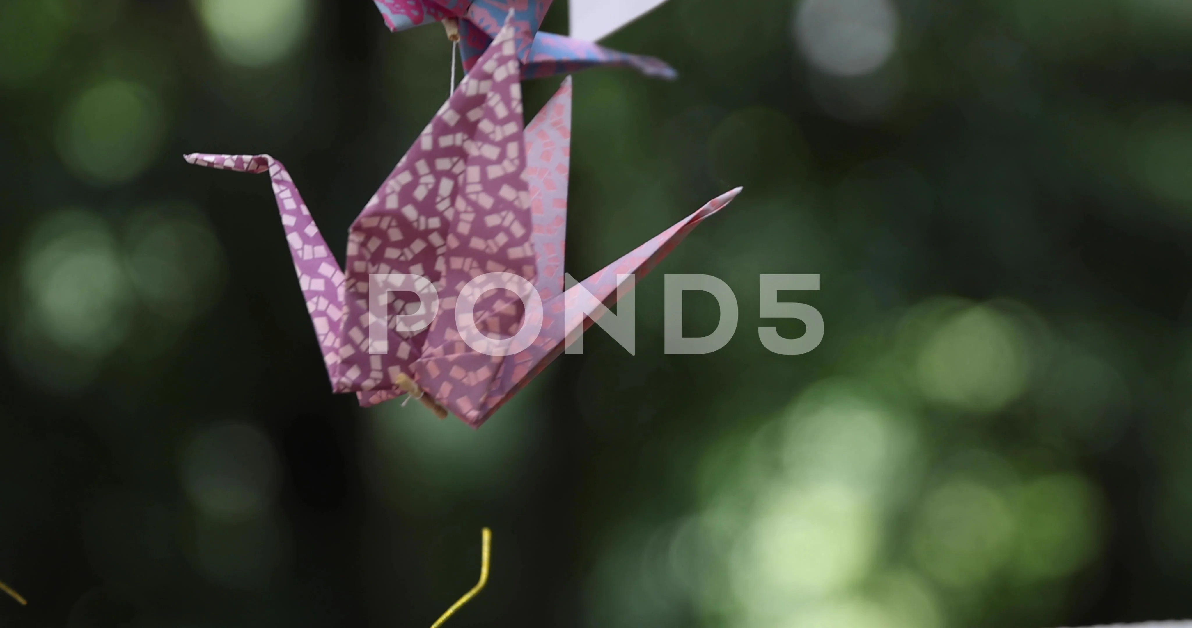 Red Origami Paper Crane On Red Background Closeup High-Res Stock