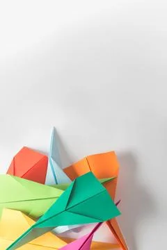 Paper, creative and shape with plane in studio for colorful, craft and design of Foto stock