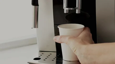 Paper cup of takeaway coffee in the hand. Barista making fresh takeaway coffee Stock Footage 232800158