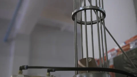 Paper cups are moved to packing area by pneumatic mail. Factory or plant indoor Stock Footage 93330085