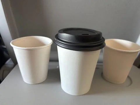 Paper cups in flight Stock Photos